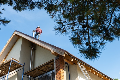 man working on roof